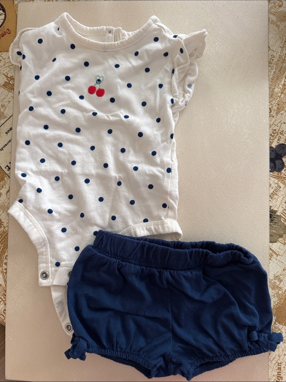 Carter's White Polka Dot Bodysuit with Navy Shorts and Cherry Accent